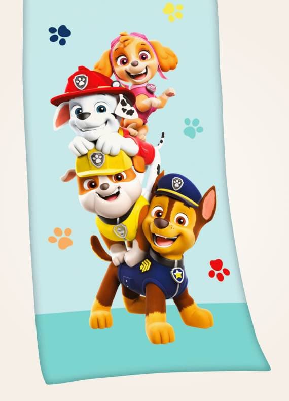 Handtuch mit Motiv: Vier Paw Patrol-Charaktere stapeln sich spielerisch vor einem hellblauen Hintergrund mit bunten Pfotenabdrücken.