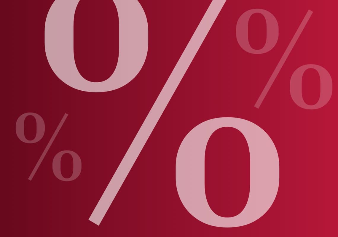 %-Zeichen in verschiedenen Größen auf rotem Hintergrund